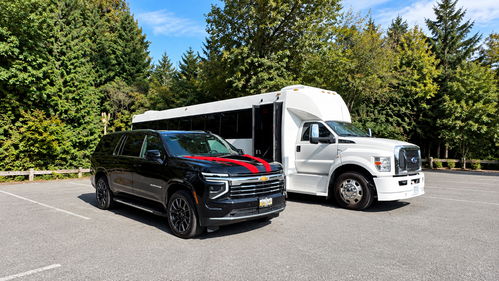 Black Suburban alongside the white executive shuttle bus